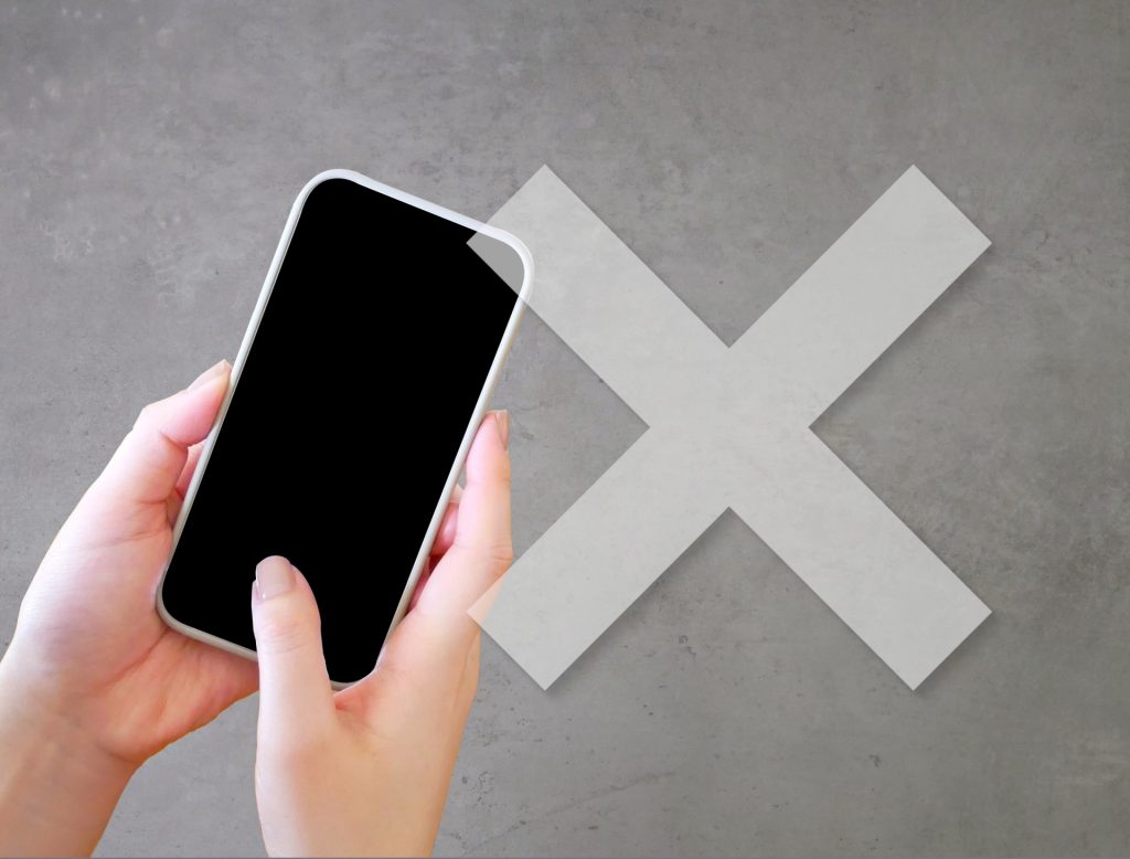 画像：スマートフォンとバツマーク